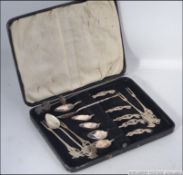 A cased set of six Malaysian silver ( tested ) tea spoons with decorative sea creature handles
