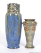 Two Royal Doulton vases each with floral c-scroll decoration to body, blue and light green glaze,