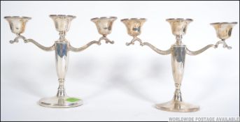 A pair of silver hallmarked candelabra.