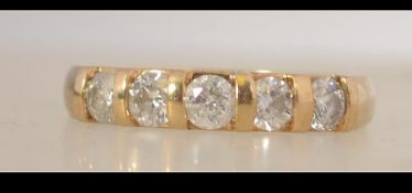 A hallmarked 9ct gold five stone diamond ring set with .75pts diamonds. Size N.5. Weight 3g.