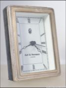 A silver miniature 925 easel clock by Ar D Norman. Sheffield rose with 925 markings.