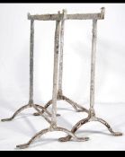 A pair of early 20th century workmens cast metal trestle ends ideal for conversion to table legs