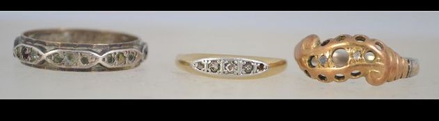 A 9ct gold and silver band ring together with a 9ct gold and diamond ring and another white and