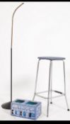 A retro 1960's chrome stool together with a goose neck anglepoise standard lamp,