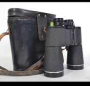 A pair of vintage Russian Binoculars by Tento complete in the leather case