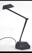 A retro 20th century anglepoise style desk / work lamp having a heavy shaped base with applied