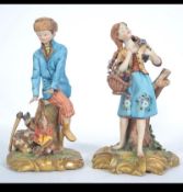 A pair of Capodimonte figurines by Volta, one of a boy,