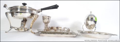 A collection of silver plates wars to include a flambe pan on stand together with an egg coddler,