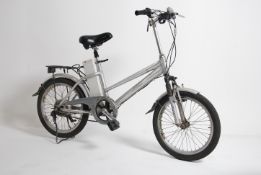 An electric bicycle with battery in silver by Headway having battery to upright with mudguards,