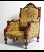 A 20th century large hardwood and gilt finish throne chair - armchair being raised on turned legs