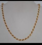 A hallmarked 9ct gold rope twist chain. Measures 18 inches. Weight 12.5g.