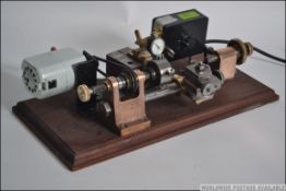 An original vintage watch makers lathe/ hobby lathe.with mercer dial / gauge.