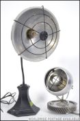 A 20th century industrial converted gas lamp having a wire dome head mounted on gooseneck being
