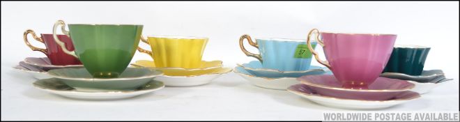 Four vintage Royal Stuart bone China trio's in different colours along with two other tea cups and
