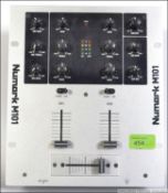 A retro 1990's Numark M101 2 Channel DJ Mixer deck with a polished steel finish.