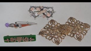 A 9ct gold and jade brooch with forget me not gold on a bar of jade with pin verso together with a