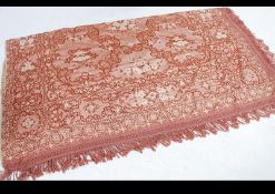 A believed Malayan - Eastern hand embroidered throw with tassled ends having been returned to the