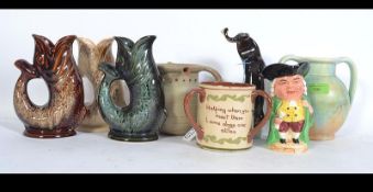 A collection of ceramics to include a USSR ceramic figurine of an otter with a fish,