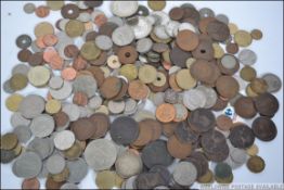 A collection of coins from all around the world some dating to the late 18th century to include