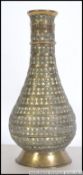 A 19th century heavy cast brass vase of anglo colonial origin with geometric design,