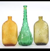 A mid century Italian green glass moulded vase having mottled finish together with a pair of