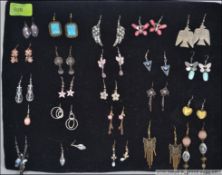 A collection of costume jewellery ladies earrings all mounted on a cushion to include silver 925