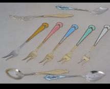 A collection Norwegian sterling silver and enamel pickle forks possibly by Finn Jensen and another.