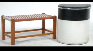 A retro 20th century 1960's two tone black and white vinyl laundry basket with hinged lid along