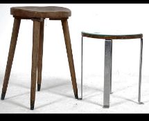A vintage / retro 20th century kidney shaped mirrored tripod occasional table along with an Arts