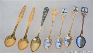 A group of Russian silver spoons to include one enamel and silver 875 spoon with lambda Greek