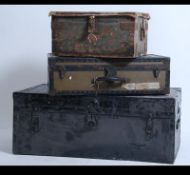 A stack of 3 vintage trunks to include a military canvas demob example.