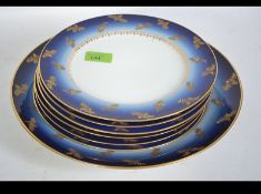 A large Fischer & Mieg german hard paste porcelain (1873 - 1918) charger together with cabinet