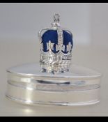 A sterling silver ring box with crown pin cushion to the lid.