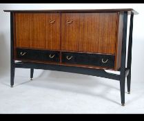 A 1950's / 60's G-Plan Librenza model sideboard having ebonised suspension set exterior frame with