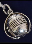 An unusual 20th century articulated silver ball locked on silver chain.