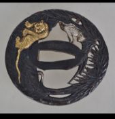 A 20th century bronze Japanese Tsuba.