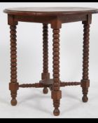 A late 19th century country oak side table with bobbin turned legs in the William & Mary style.