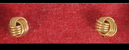 4 pairs of 9ct gold earrings. Total weight 2.4g excluding non gold backs.