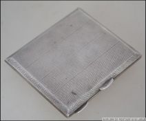 A silver hallmarked cigarette case bearing marks for Birmingham 1917 by Dudley Russell Howitt