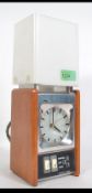 A retro 1970's Russell Hobbs alarm clock light in teak case with shade. Model No 7002.