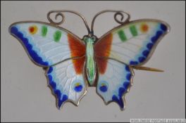 A silver hallmarked guilloche enamel Art Nouveau ladies brooch in the form of a butterfly.