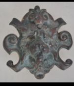 A very well cast and detailed cartouche of a Rococo lions head in bronze . Measures: 8cms long.