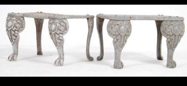 A pair of 20th century Georgian revival silvered cast metal footmans each with pierced tops on claw