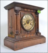 An Edwardian oak cased 