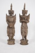 A stunning pair of tall believed early to mid 20th century well carved wooden Thai greeting figures.