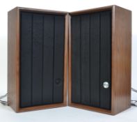 A pair of retro upright 1970's teak air suspension speakers with fabric facia's