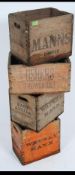 A stack of vintage wooden advertising crates for Watney Mann,