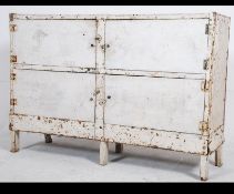 A good mid century Industrial metal cupboard / cabinet with brass screws to the metal top and frame