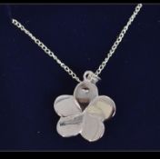 A silver and opal lucky five leaf clover necklace. Weight 8.
