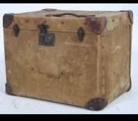 A vintage early 20th century Edwardian canvas and wood bound steamer trunk of square form with